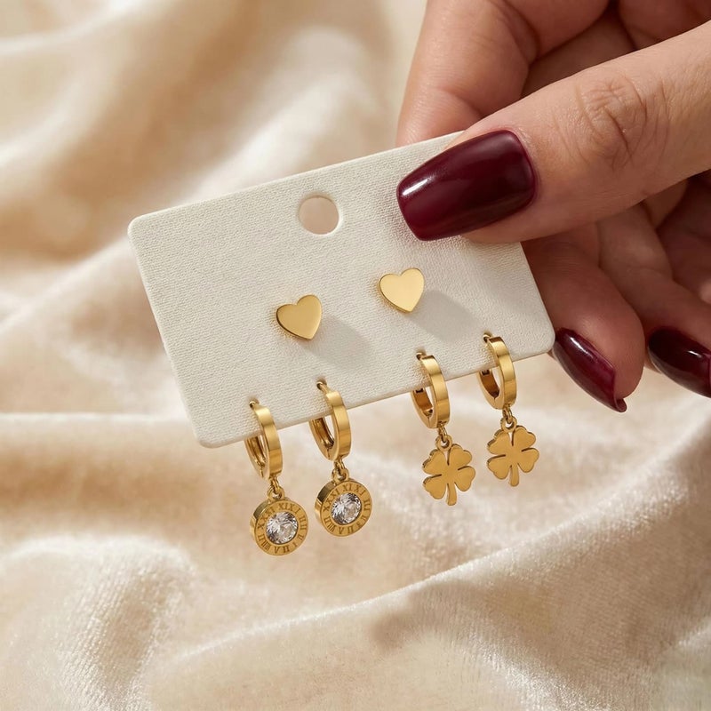 A set of three pairs of gold earrings; combining a delicate heart-shaped design, dangling circles with sparkling zircon stones, and a charming dangling rose. Made of durable stainless steel for a unique look. - Image 5